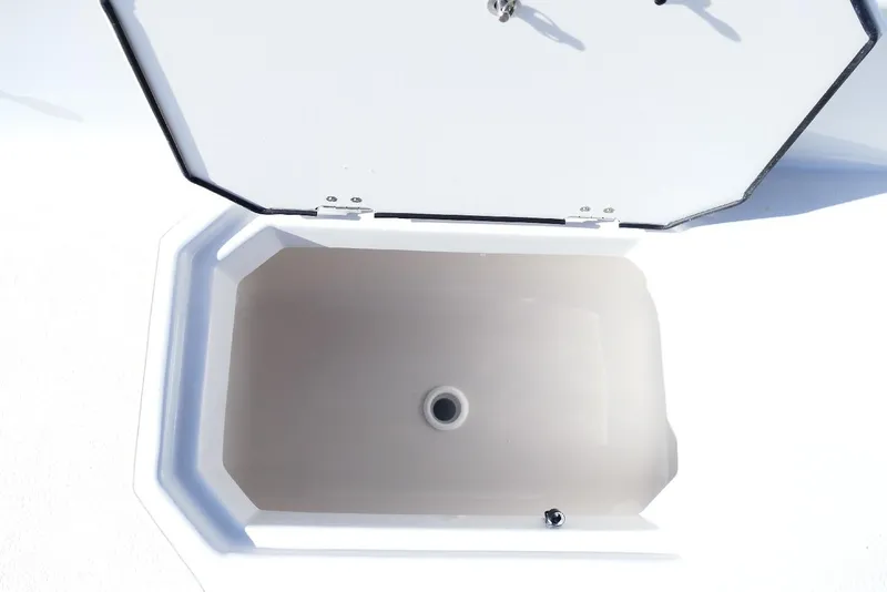 Slide: The Image of Open storage compartment on 2026 Starcraft SVX 211 OB boat. - 26