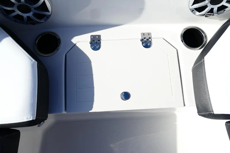 Slide: The Image of 2026 Starcraft SVX 211 OB boat interior with speakers, cup holders, and storage compartment. - 30