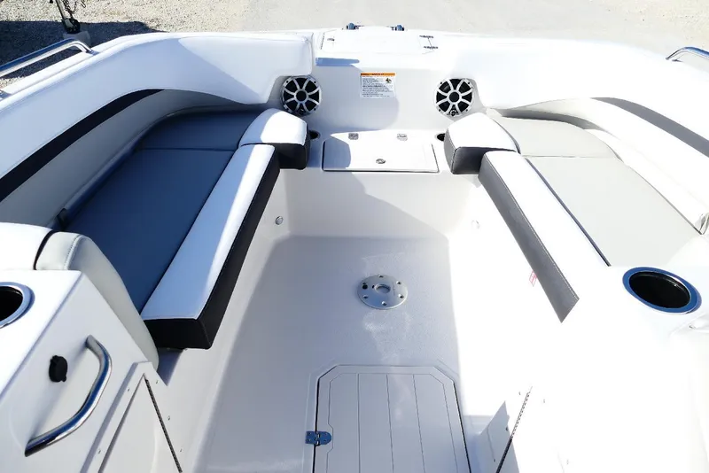 Slide: The Image of 2026 Starcraft SVX 211 OB boat interior with cushioned seating and cup holders. - 37