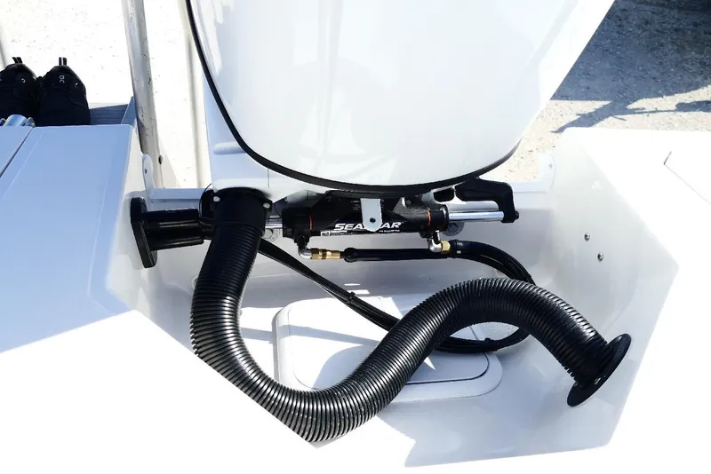 Slide: The Image of 2026 Starcraft SVX 211 OB boat engine compartment with hydraulic steering system. - 40