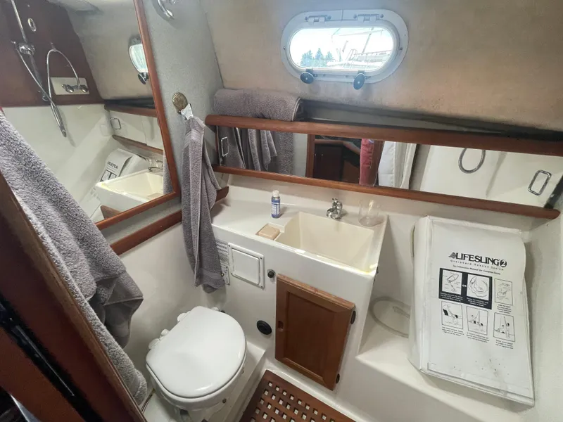 Slide: The Image of 1993 Bayliner 3288 helm with steering wheel, gauges, and navigation equipment. - 7