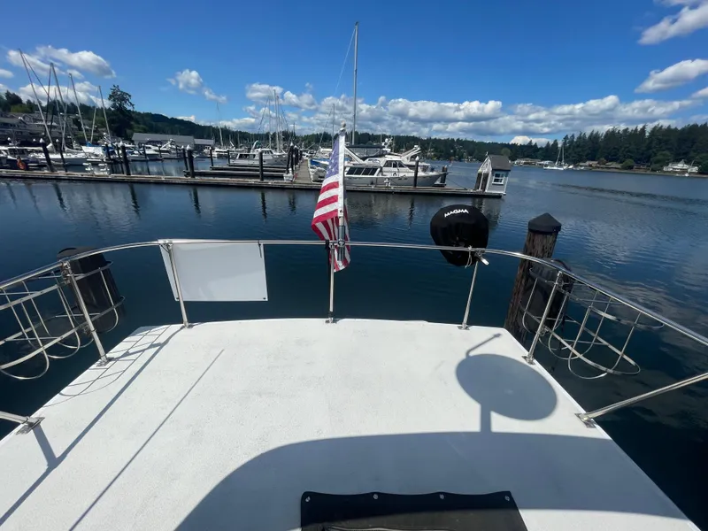 Slide: The Image of Interior of 1993 Bayliner 3288 Motoryacht with dining area and kitchen. - 9