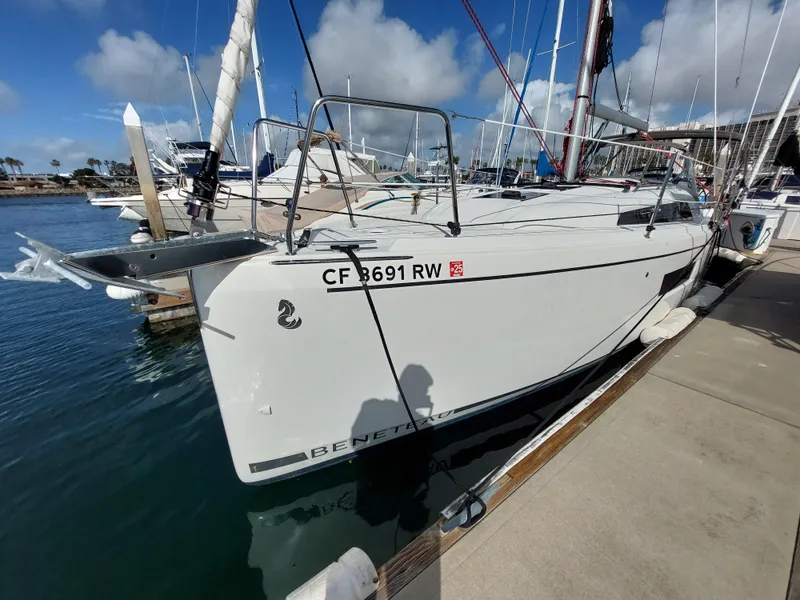 Slide: The Image of 2020 Beneteau Oceanis 30.1 sailboat docked at marina under blue sky. - 1