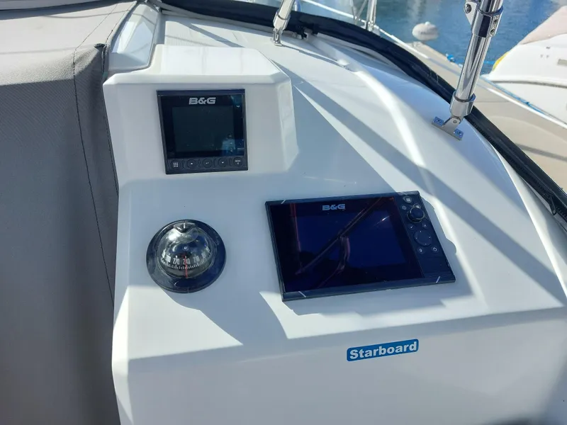 Slide: The Image of Control panel of 2020 Beneteau Oceanis 30.1 sailboat with navigation instruments. - 10