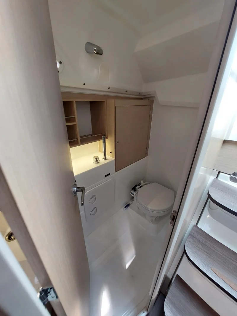 Slide: The Image of Beneteau Oceanis 30.1 2020 yacht bathroom with compact design and modern fixtures. - 31