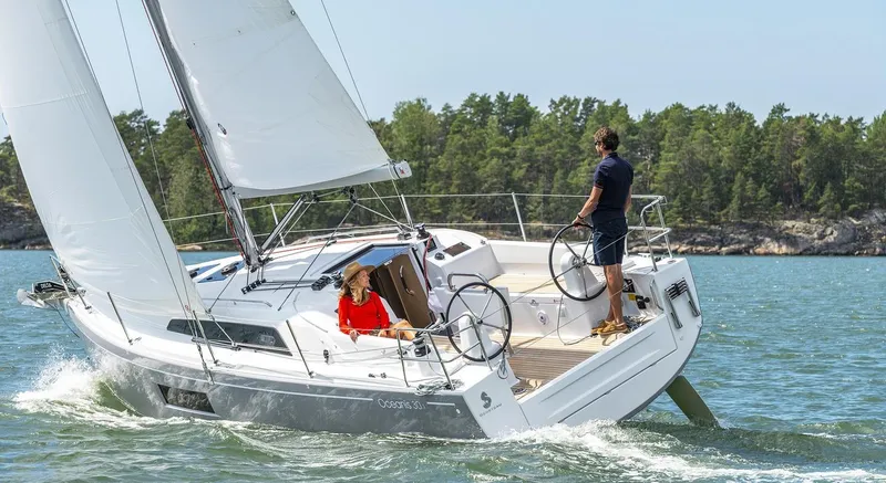 Slide: The Image of 2020 Beneteau Oceanis 30.1 sailing on a sunny day with two people onboard. - 4