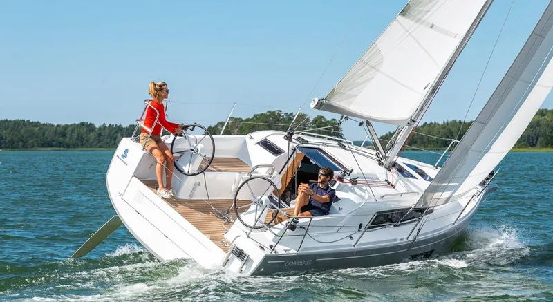 Slide: The Image of 2020 Beneteau Oceanis 30.1 sailing on a sunny day with two people onboard. - 5