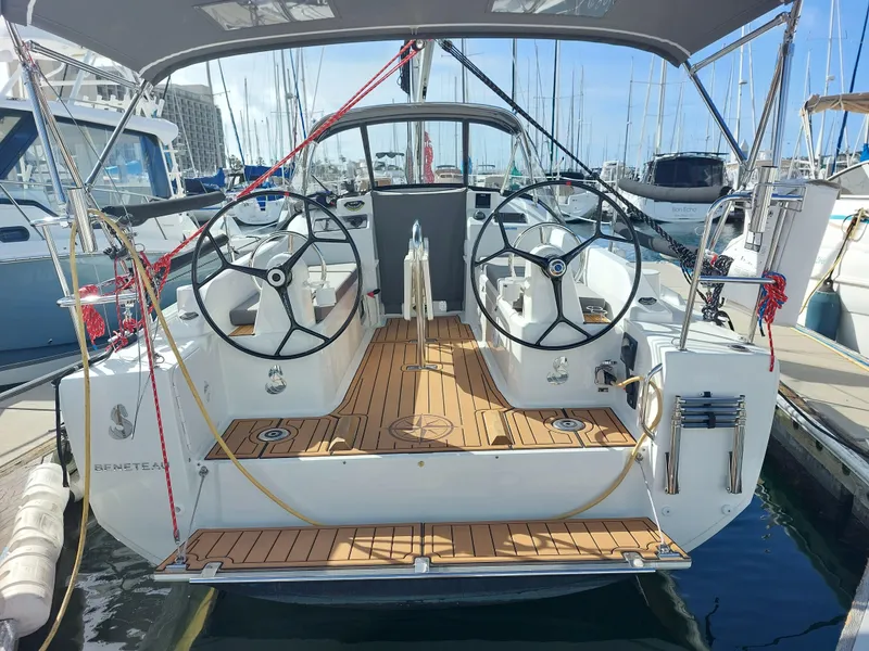 Slide: The Image of Beneteau Oceanis 30.1 sailboat, 2020 model, docked with dual steering wheels and teak deck. - 6