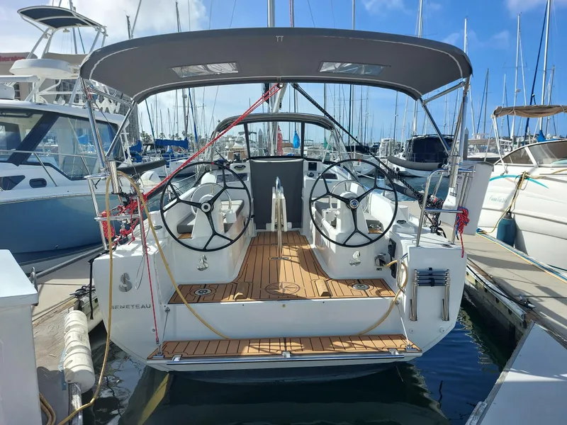 Slide: The Image of Beneteau Oceanis 30.1 sailboat, 2020 model, docked at marina with dual steering wheels. - 7