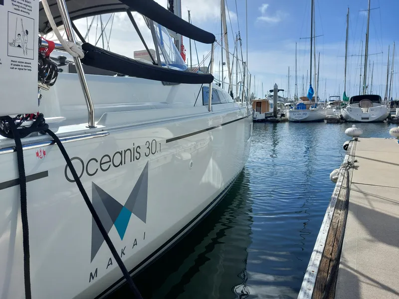 Slide: The Image of Beneteau Oceanis 30.1 sailboat docked in marina, 2020 model, side view. - 8