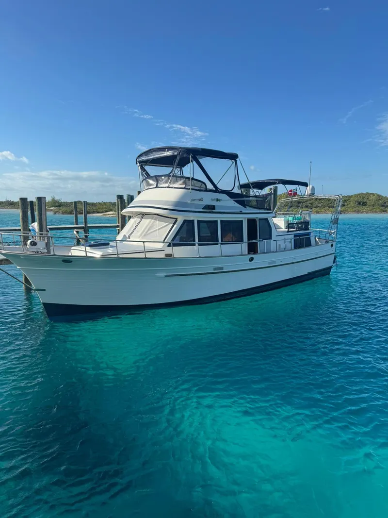 Slide: The Image of 1982 Albin 43 yacht on clear blue water under a sunny sky. - 0