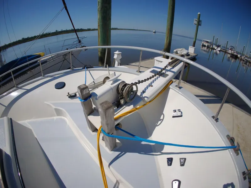 Slide: The Image of 1982 Albin 43 yacht deck with winch and ropes at marina. - 10