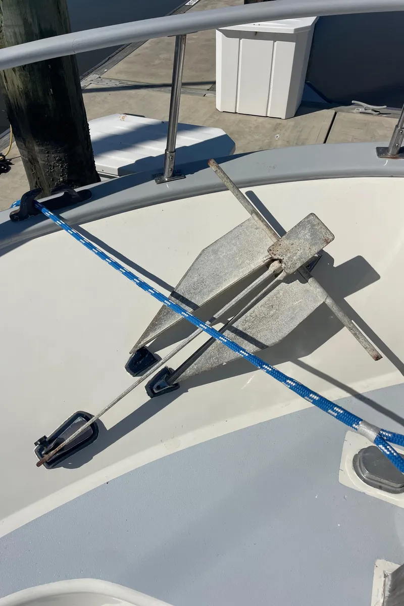 Slide: The Image of Anchor setup on 1982 Albin 43 boat deck with blue rope. - 12