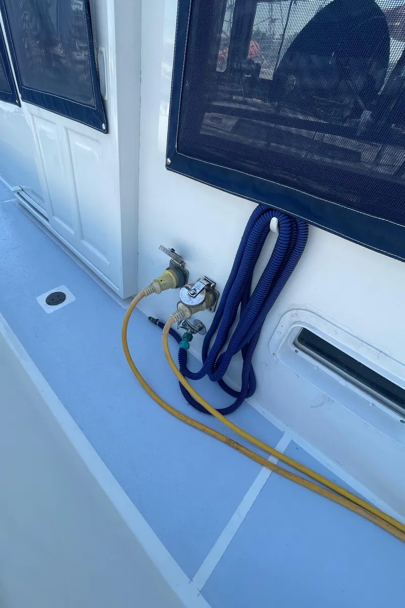 Slide: The Image of 1982 Albin 43 boat deck with cables and coiled rope. - 13