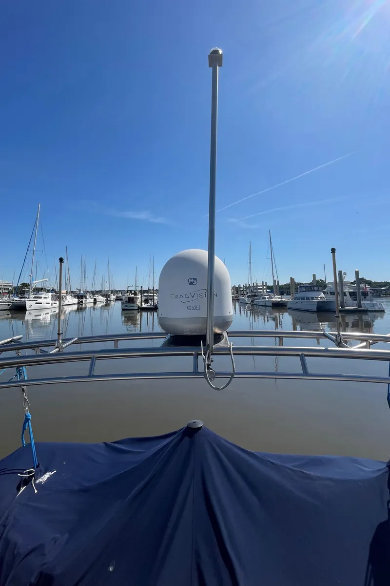 Slide: The Image of 1982 Albin 43 boat docked in a marina under clear blue skies. - 16