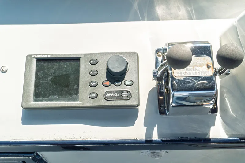 Slide: The Image of Control panel of a 1982 Albin 43 boat with navigation and engine controls. - 30