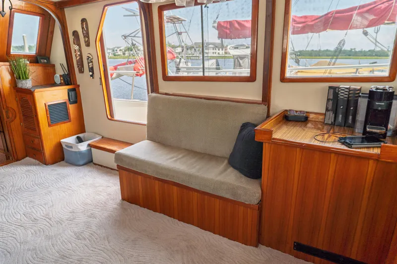 Slide: The Image of Interior of 1982 Albin 43 yacht with wooden furnishings and cozy seating area. - 32