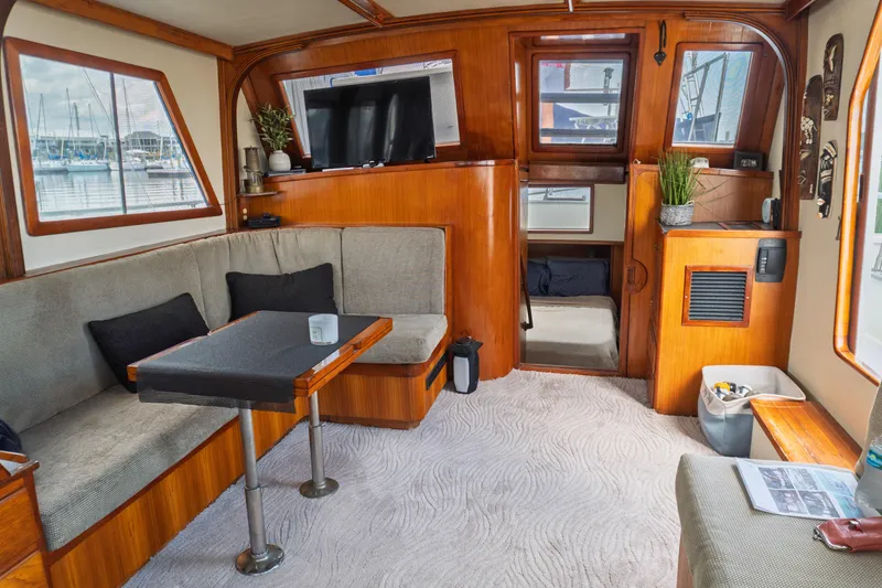 Slide: The Image of Interior of 1982 Albin 43 yacht with cozy seating and wooden accents. - 34