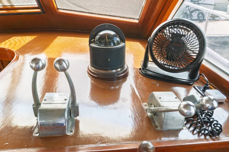 Slide: The Image of Control panel of a 1982 Albin 43 boat with compass and fan. - 42