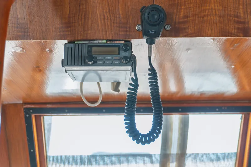 Slide: The Image of Radio equipment inside a 1982 Albin 43 boat, mounted on a wooden panel. - 46