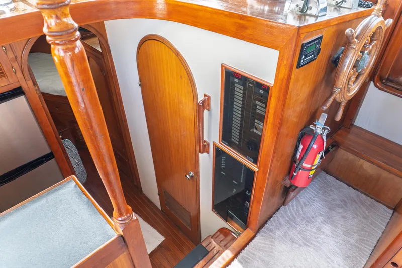 Slide: The Image of Interior of 1982 Albin 43 boat with wooden paneling and steering wheel. - 49