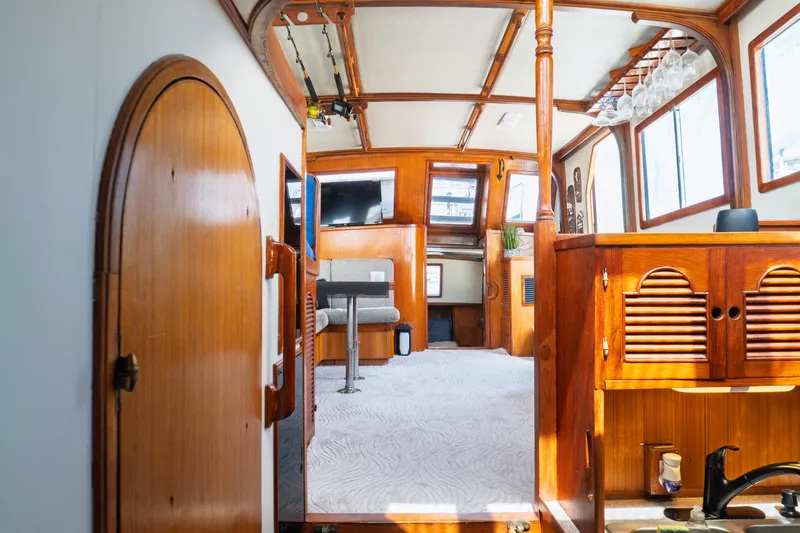 Slide: The Image of Interior of 1982 Albin 43 boat with wooden finishes and modern amenities. - 53