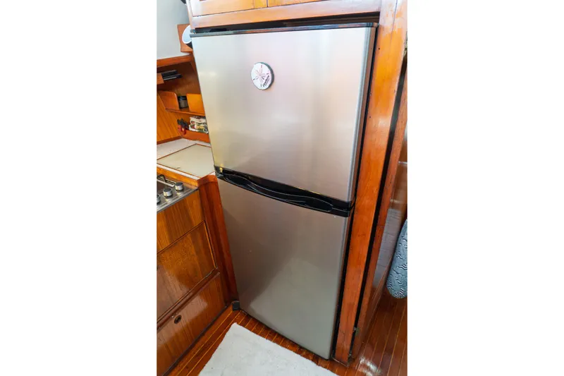 Slide: The Image of Stainless steel refrigerator in 1982 Albin 43 yacht kitchen interior. - 62