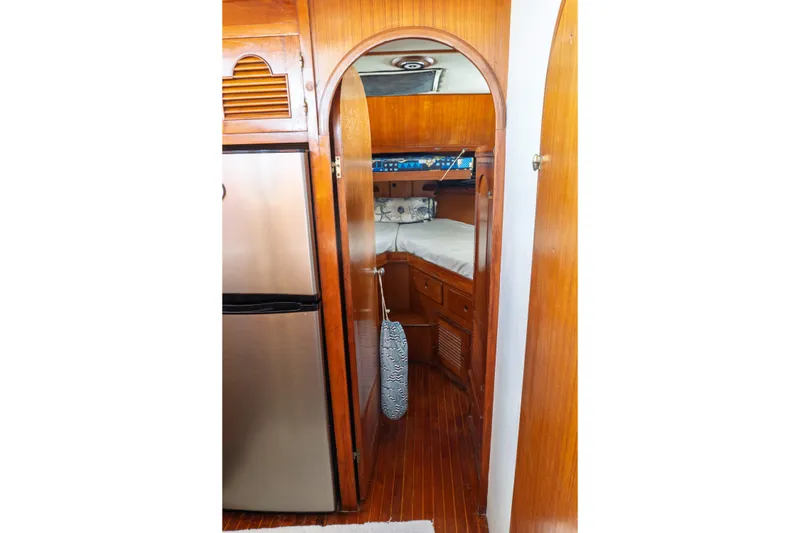 Slide: The Image of Interior of 1982 Albin 43 yacht with wooden cabinetry and cozy sleeping quarters. - 63