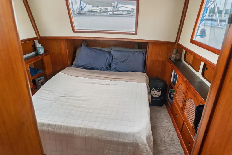 Slide: The Image of Cozy cabin interior of 1982 Albin 43 yacht with wooden furnishings and comfortable bedding. - 73