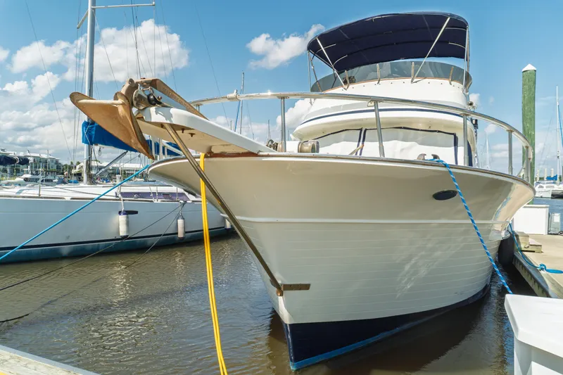 Slide: The Image of 1982 Albin 43 yacht docked at marina under blue sky. - 8