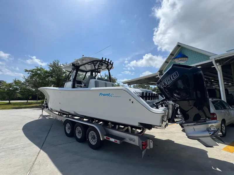 Slide: The Image of 2023 Front Runner 36 Center Console boat on trailer, rear view close-up. - 16