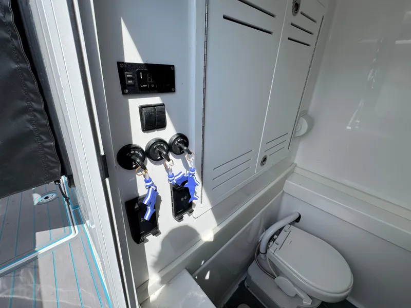 Slide: The Image of 2023 Front Runner 36 Center Console boat, sleek design, docked outdoors. - 26