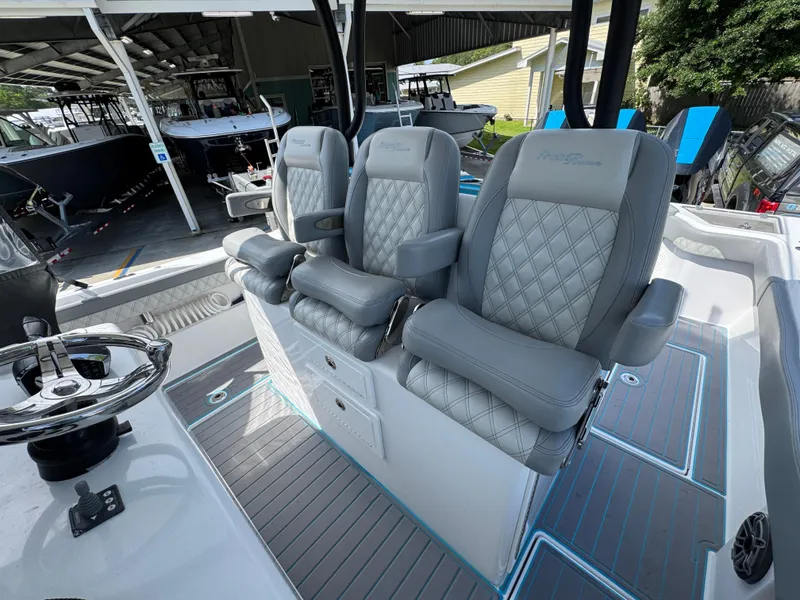 Slide: The Image of 2023 Front Runner 36 Center Console boat interior with compact bathroom amenities. - 29