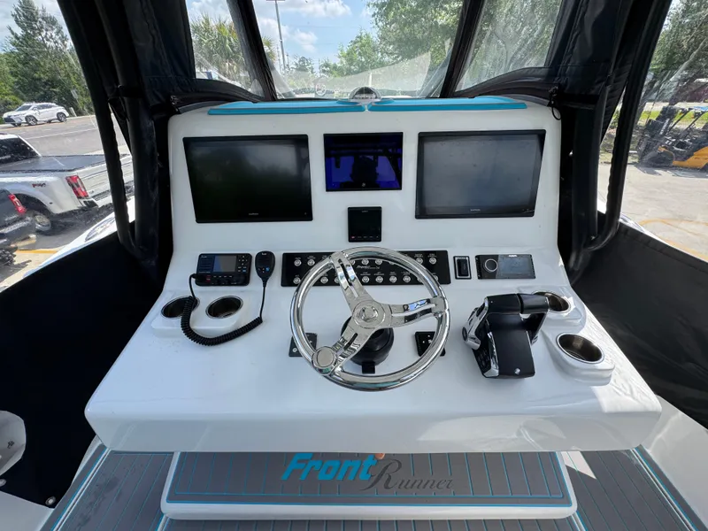 Slide: The Image of 2023 Front Runner 36 Center Console boat interior with Garmin and Mercury equipment. - 32