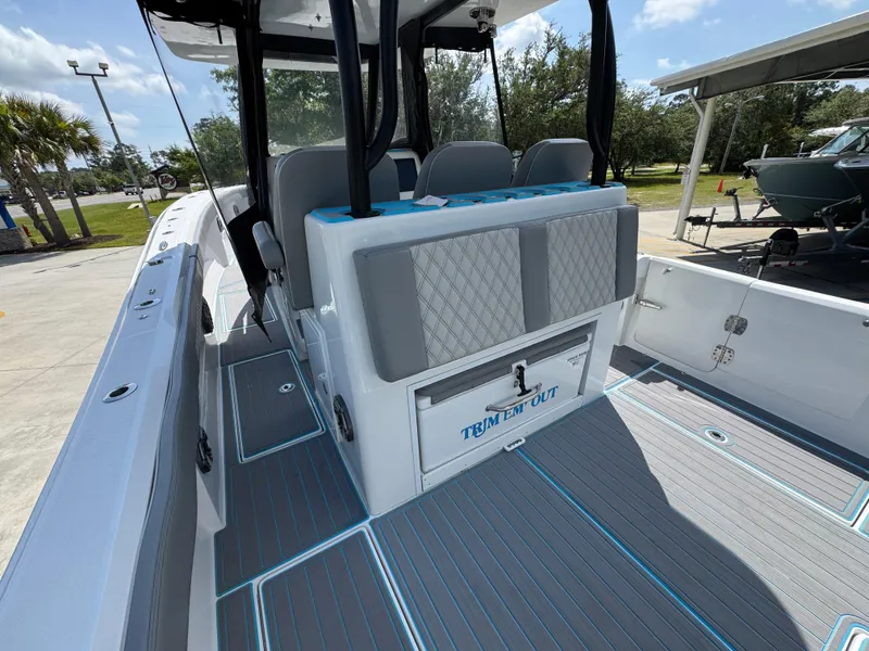 Slide: The Image of 2023 Front Runner 36 Center Console boat dashboard with Garmin displays and Mercury controls. - 33