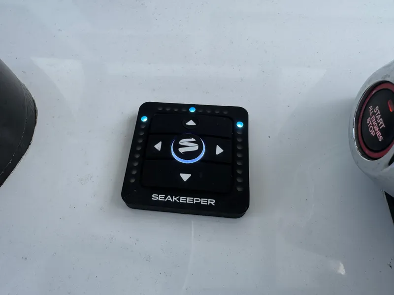 Slide: The Image of 2023 Front Runner 36 Center Console boat interior, featuring a speaker and storage compartment. - 41