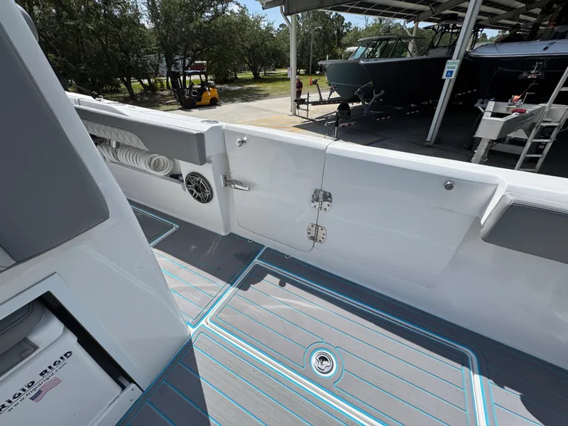 Slide: The Image of 2023 Front Runner 36 Center Console boat with triple engines in a showroom. - 42