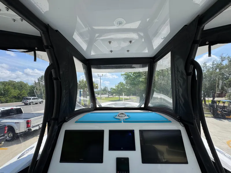 Slide: The Image of 2023 Front Runner 36 Center Console boat with triple engines and luxurious seating. - 43