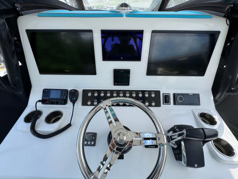 Slide: The Image of 2023 Front Runner 36 Center Console with triple Mercury Racing 400 outboard engines at Grander Marine. - 44