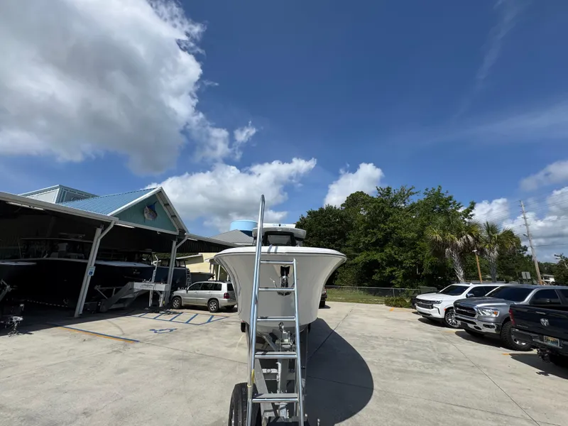 Slide: The Image of 2023 Front Runner 36 Center Console boat on trailer under a cloudy sky. - 7
