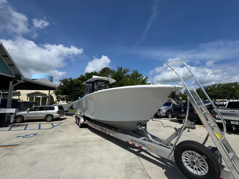 Slide: The Image of 2023 Front Runner 36 Center Console boat on trailer, parked outdoors. - 8