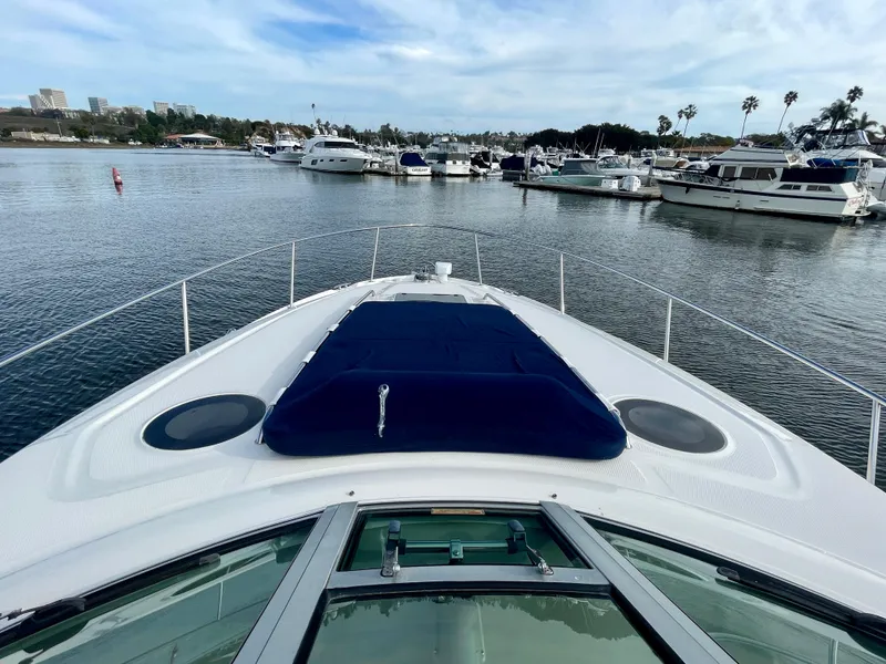 Slide: The Image of 2006 Sea Ray 320 Sundancer yacht docked in a marina, view from the bow. - 24
