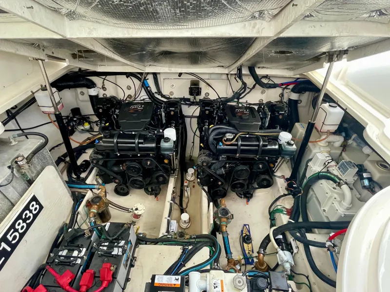 Slide: The Image of Engine room of a 2006 Sea Ray 320 Sundancer with dual engines and wiring. - 36
