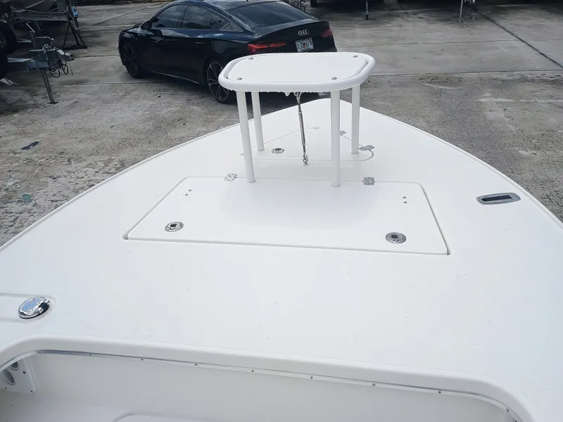 Slide: The Image of Bow of 2023 Sterling 180TS boat with elevated platform, parked on concrete. - 13