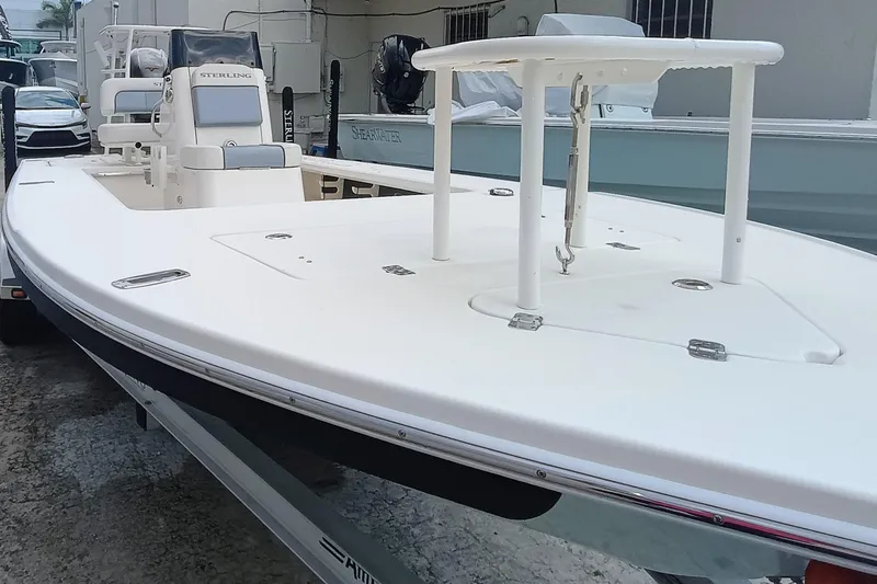 Slide: The Image of 2023 Sterling 180TS boat on trailer, white deck, sleek design. - 24