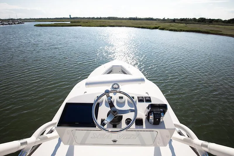 Slide: The Image of 2017 SeaVee 390OZ boat helm with water and shoreline view. - 10