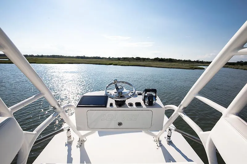 Slide: The Image of 2017 SeaVee 390OZ boat helm with scenic water view. - 11
