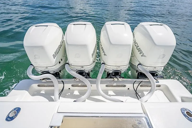 Slide: The Image of Four Mercury outboard engines on a 2017 SeaVee 390OZ boat in water. - 16