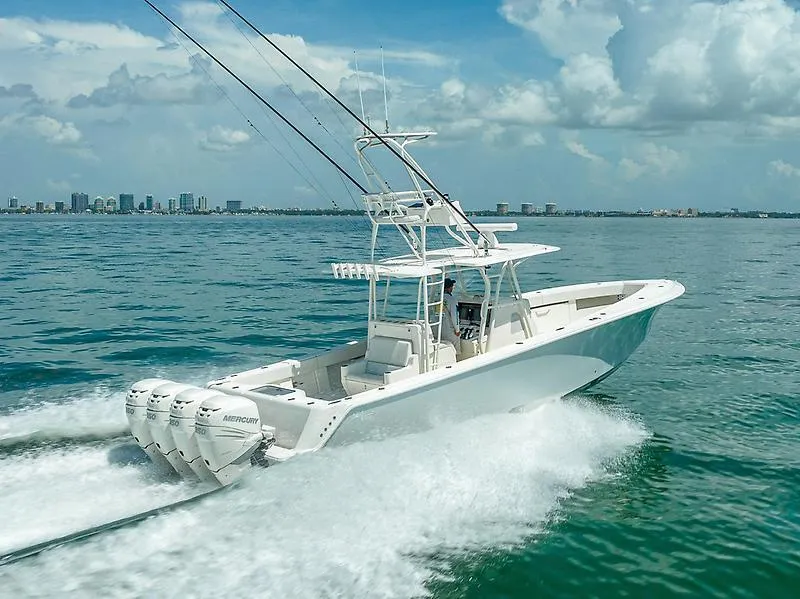 Slide: The Image of 2017 SeaVee 390OZ boat cruising on ocean with city skyline in background. - 18