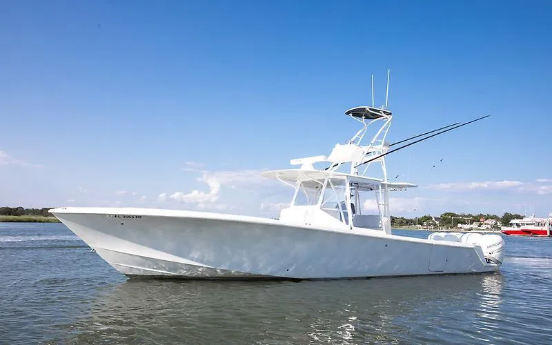 Slide: The Image of 2017 SeaVee 390OZ boat on calm water under clear blue sky. - 2